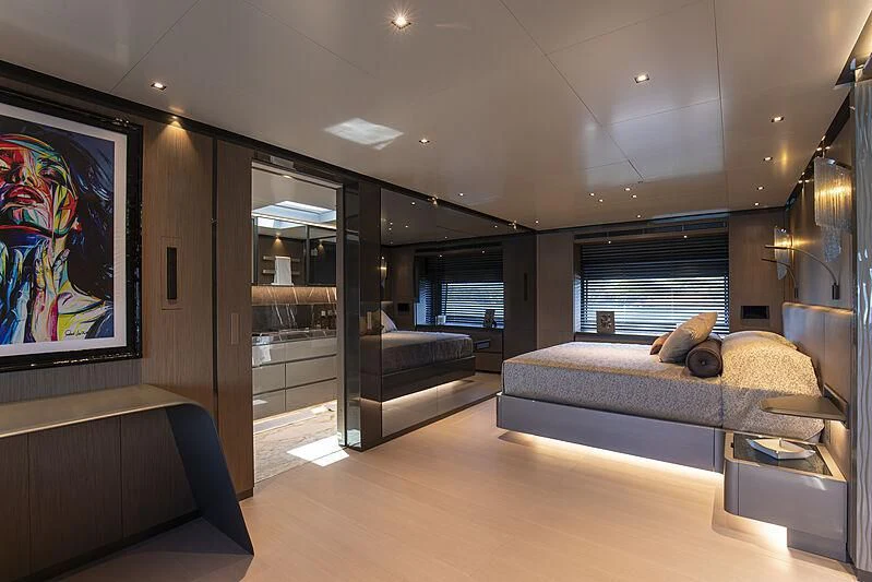 a large bedroom with a large bed aboard PANAM Yacht for Sale