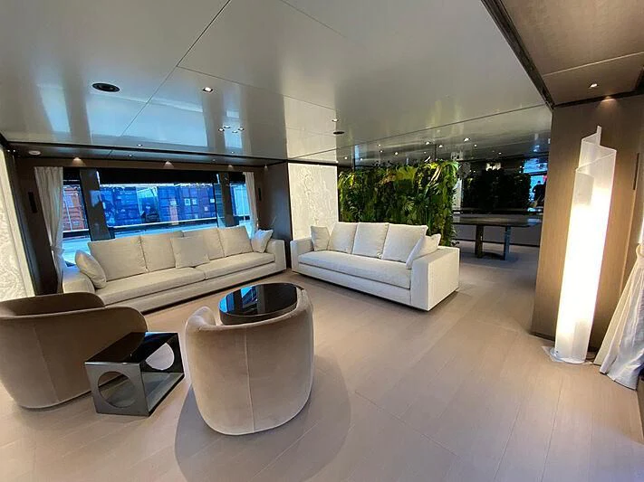 a room with a couch and a table aboard PANAM Yacht for Sale