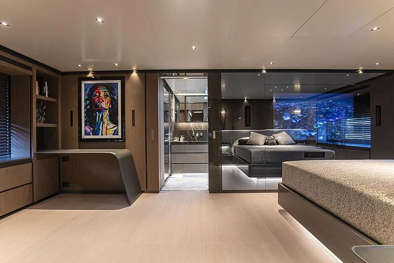 a room with a couch and a tv on the wall aboard PANAM Yacht for Sale