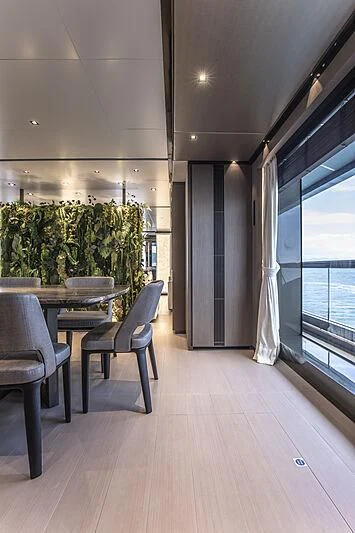 a room with a table and chairs aboard PANAM Yacht for Sale