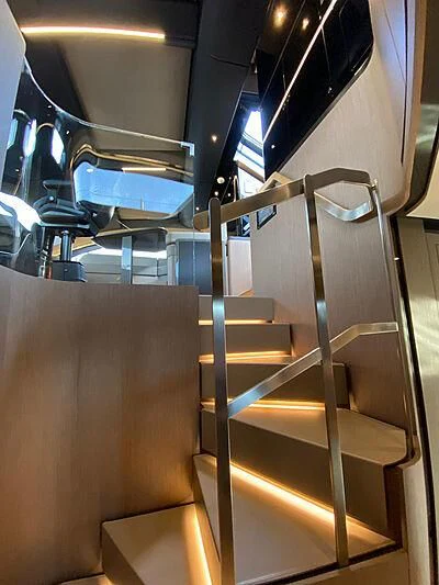 a staircase with a metal railing aboard PANAM Yacht for Sale