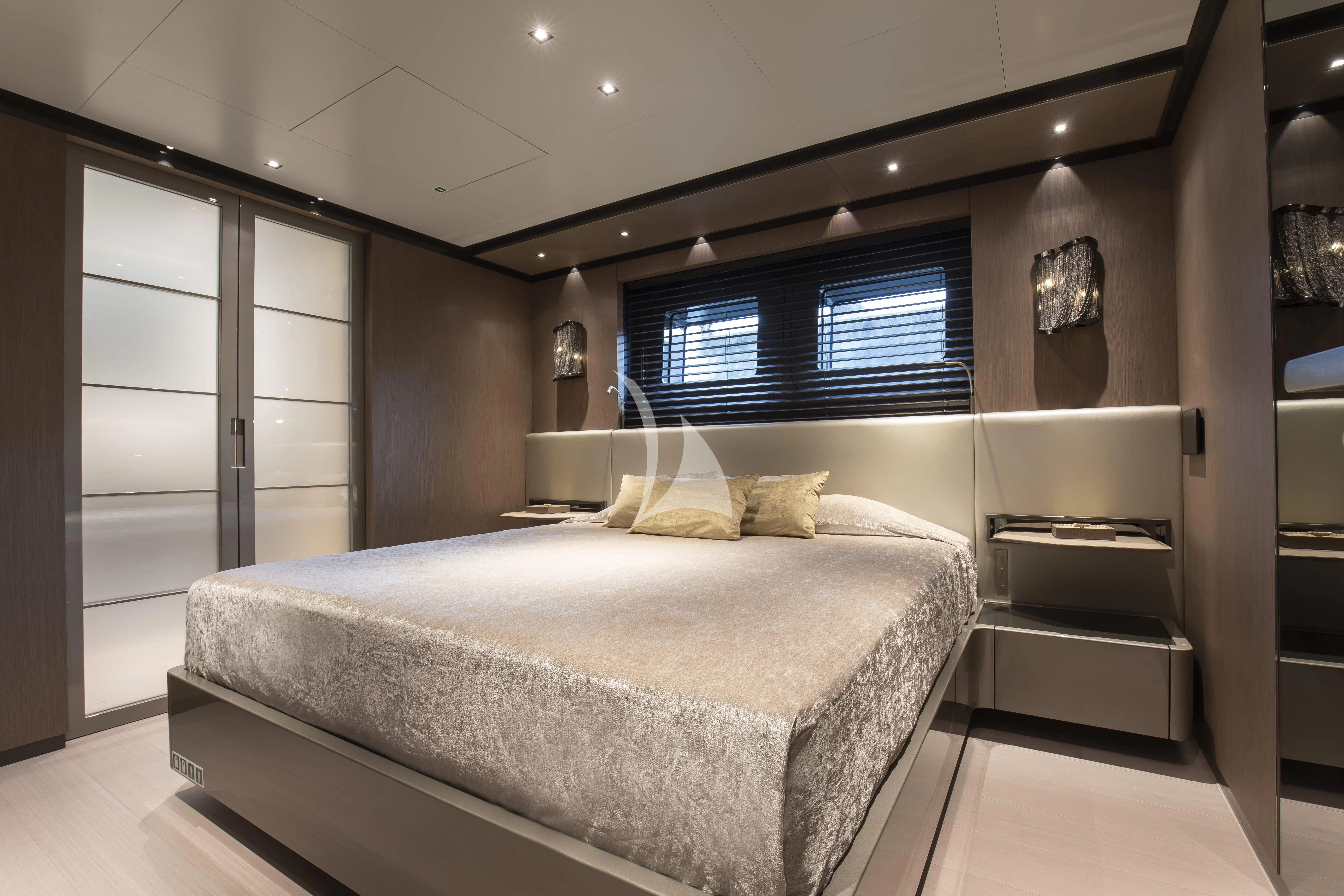 a large bedroom with a large bed aboard PANAM Yacht for Sale