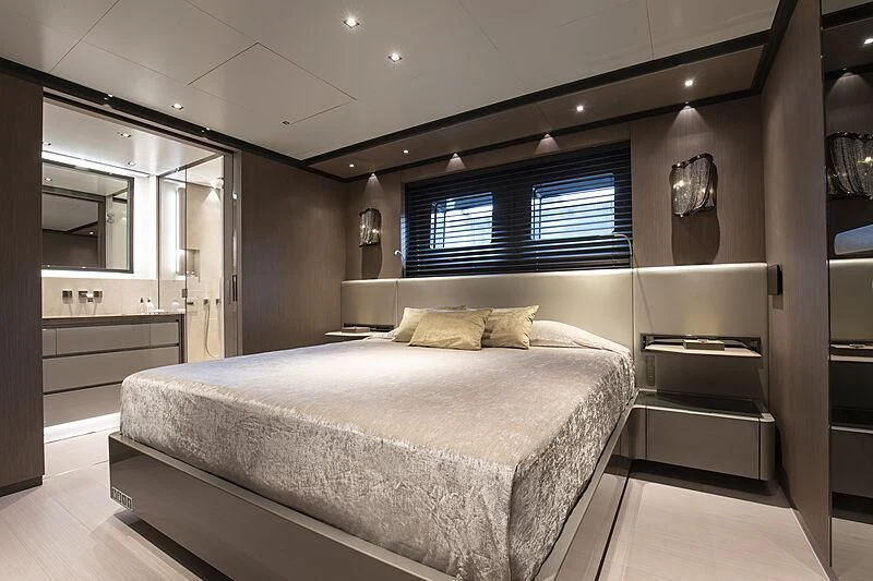 a large bedroom with a large bed aboard PANAM Yacht for Sale