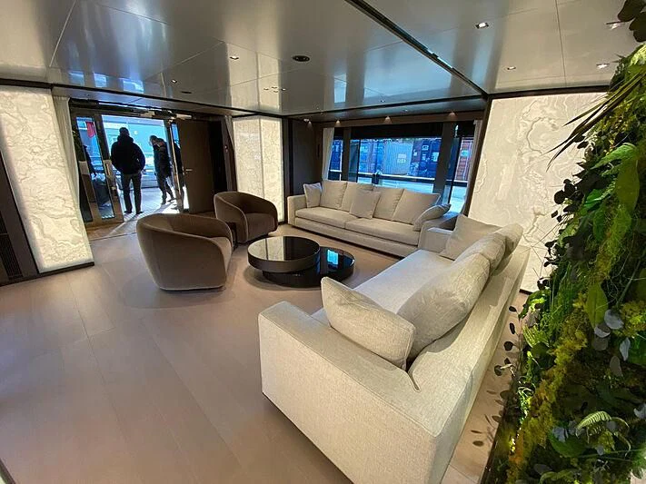 a room with couches and a table aboard PANAM Yacht for Sale