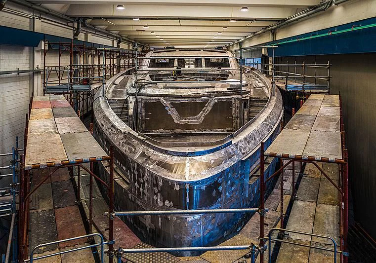 a large metal cylinder in a factory aboard PANAM Yacht for Sale