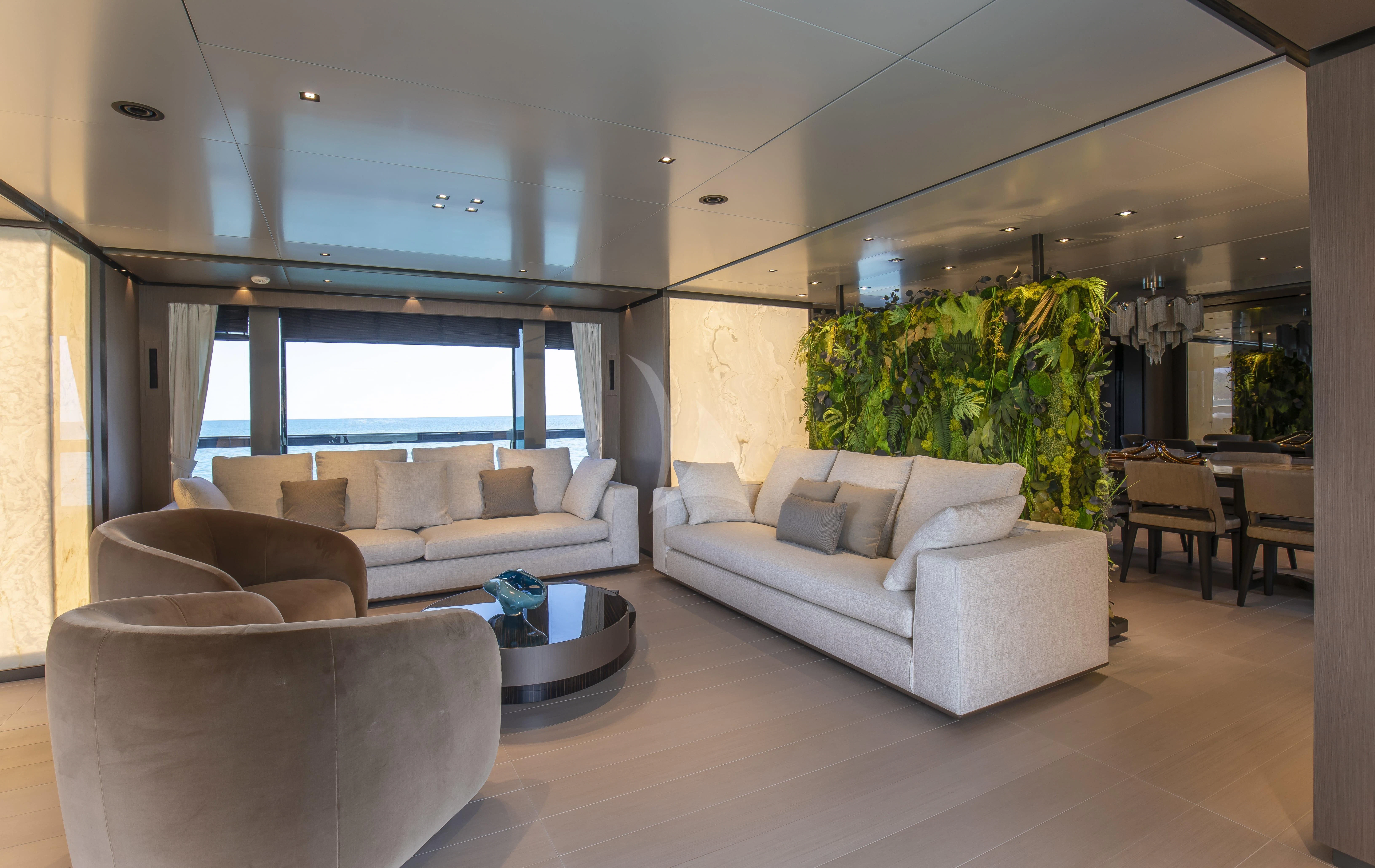 a living room with a large window aboard PANAM Yacht for Sale