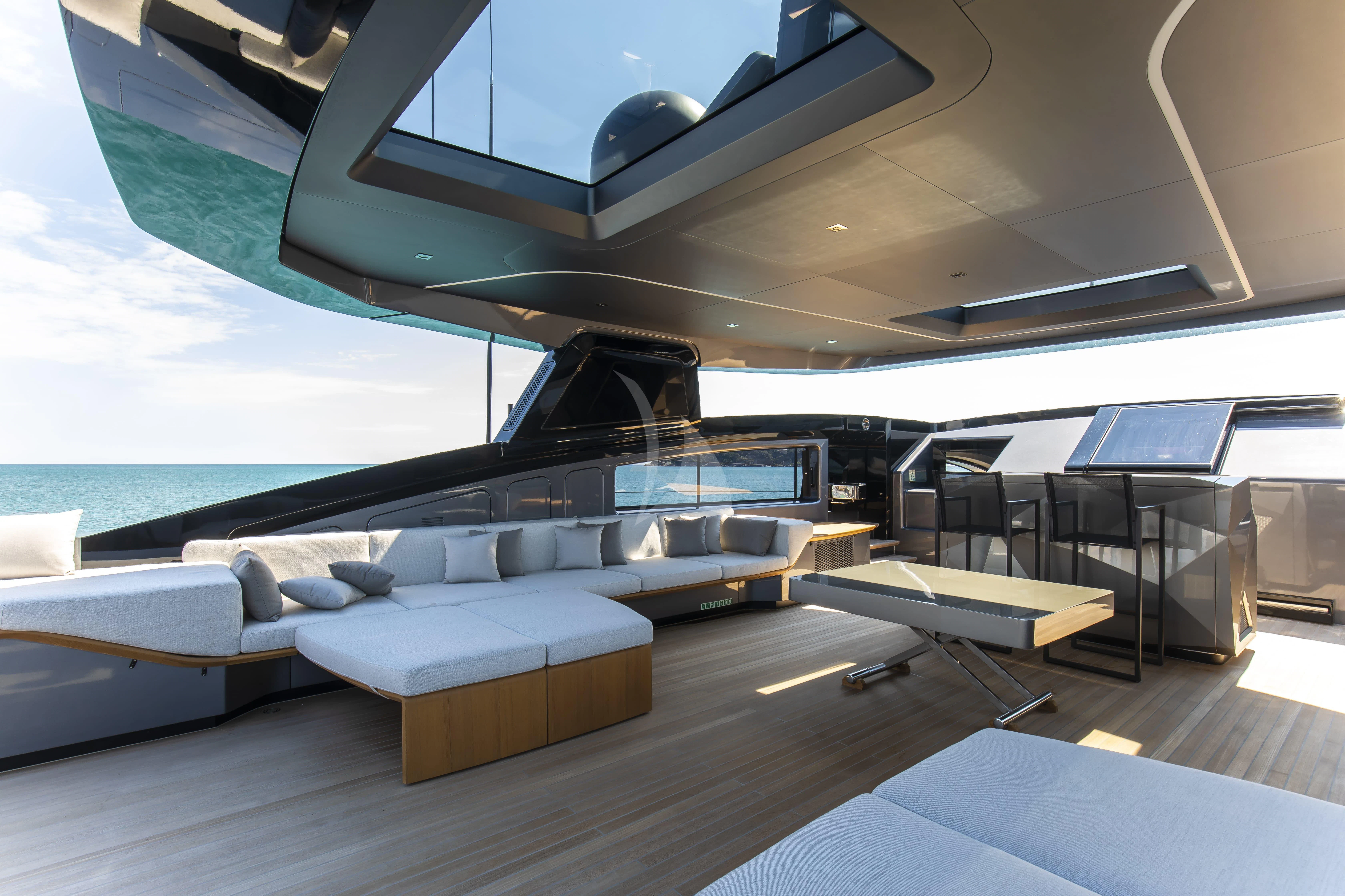 a room with a couch and a pool aboard PANAM Yacht for Sale