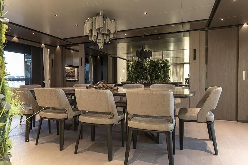 a large kitchen with a table and chairs aboard PANAM Yacht for Sale