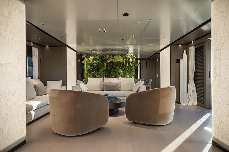 a living room with couches aboard PANAM Yacht for Sale