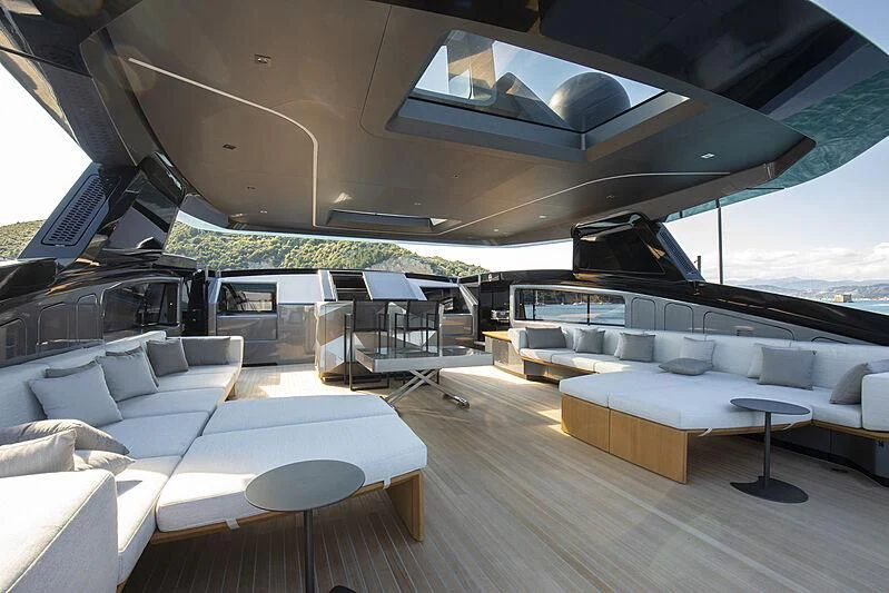 a room with a couch and a piano aboard PANAM Yacht for Sale