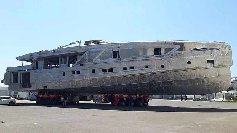 a large ship with a trailer aboard PANAM Yacht for Sale