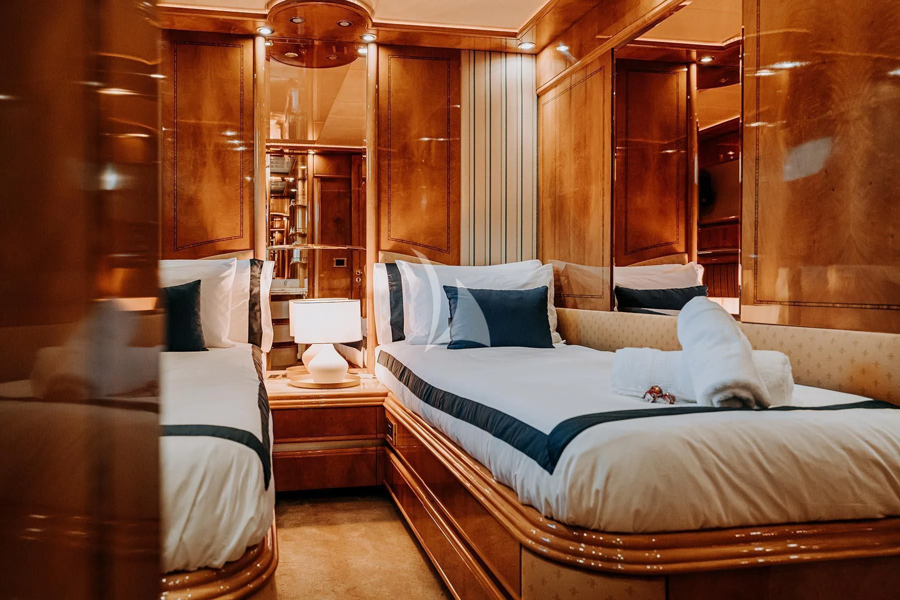 a room with a bed and a mirror aboard SONRISA SEPTIMO Yacht for Sale