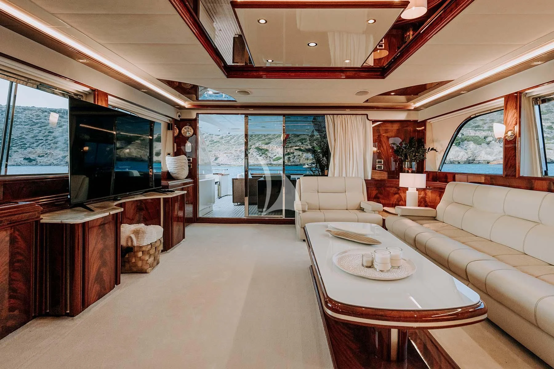 a living room with a large window aboard SONRISA SEPTIMO Yacht for Sale