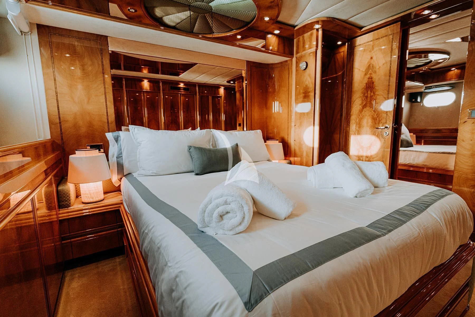 a bed with white sheets aboard SONRISA SEPTIMO Yacht for Sale