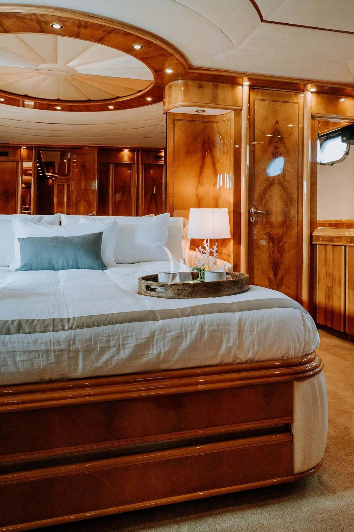 a bed with a white comforter aboard SONRISA SEPTIMO Yacht for Sale