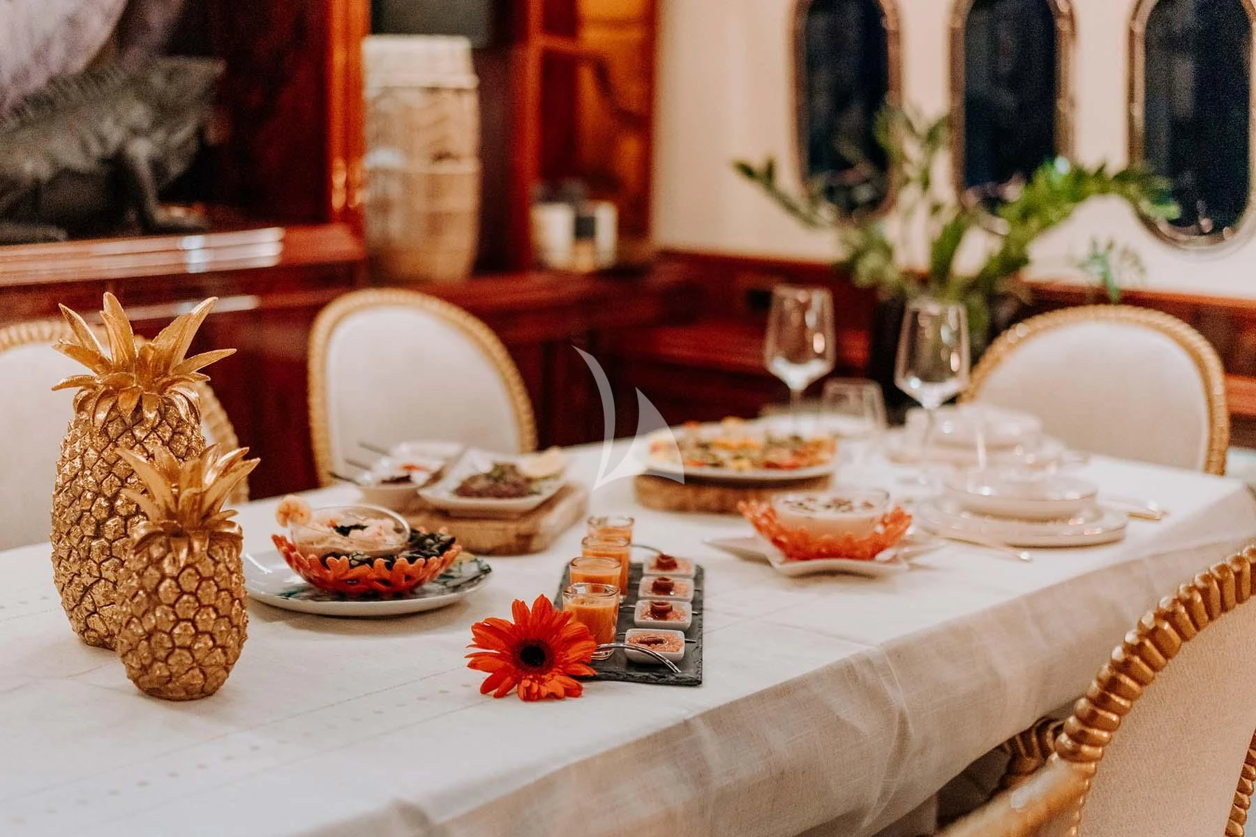 a table with food on it aboard SONRISA SEPTIMO Yacht for Sale