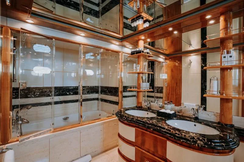 a bathroom with a glass shower aboard SONRISA SEPTIMO Yacht for Sale