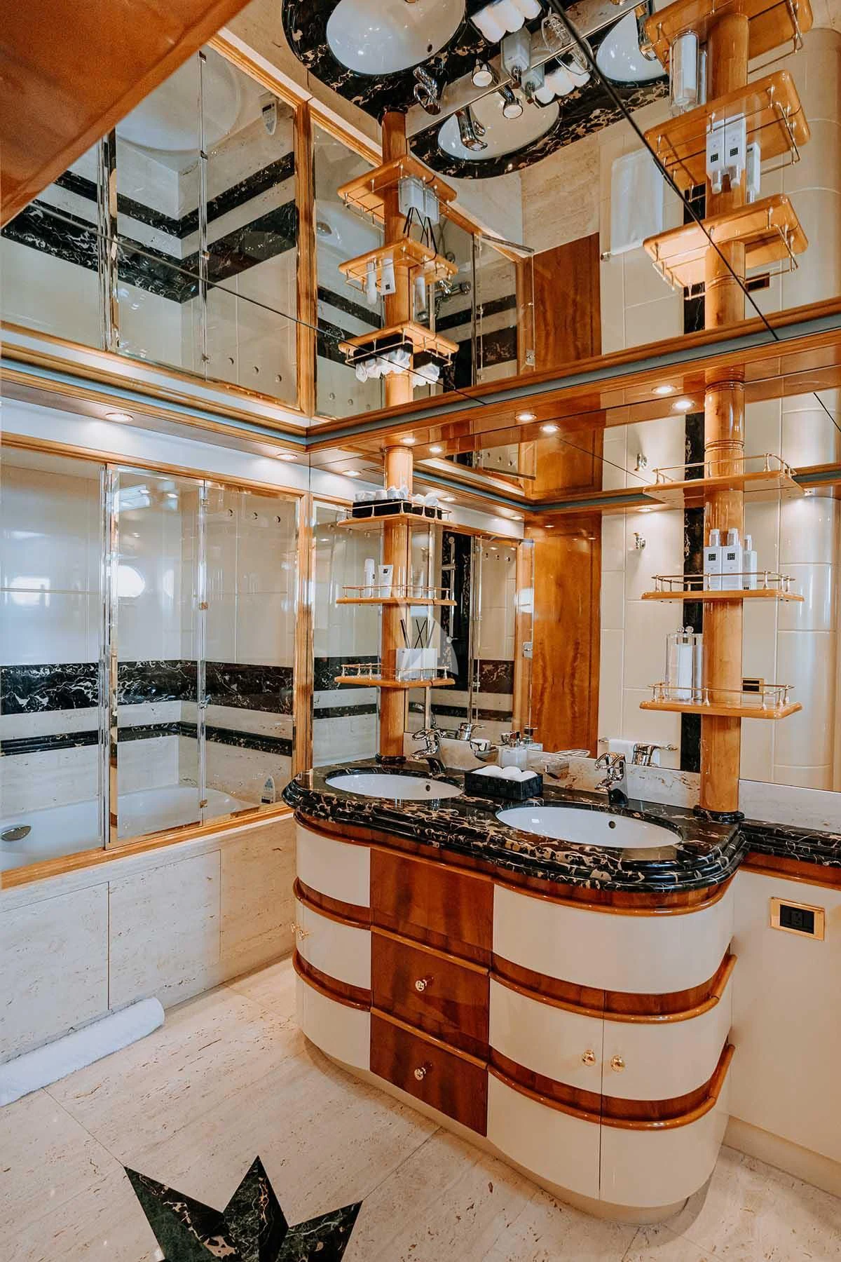a bathroom with a large mirror aboard SONRISA SEPTIMO Yacht for Sale