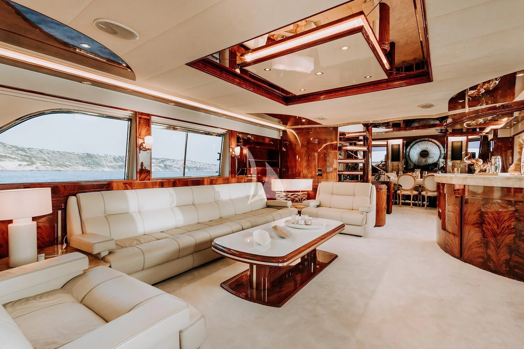 a living room with a large window aboard SONRISA SEPTIMO Yacht for Sale