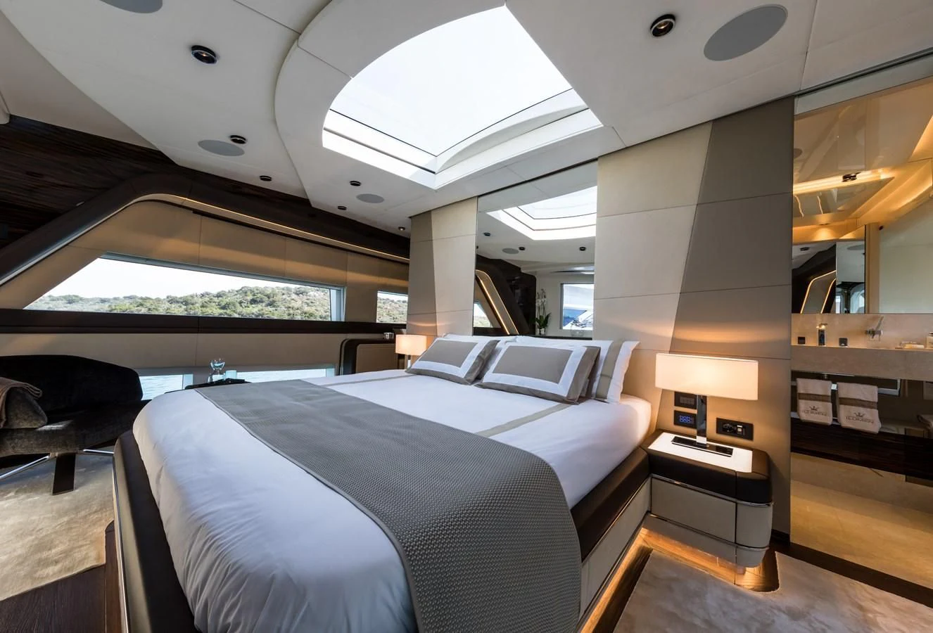 a room with a bed and a desk aboard MAXIMUS Yacht for Sale