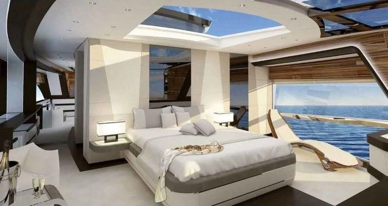 a room with a bed and a large window aboard MAXIMUS Yacht for Sale
