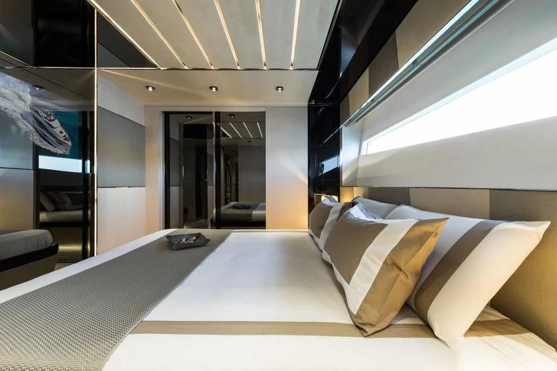 a room with a bed and a laptop on the floor aboard MAXIMUS Yacht for Sale