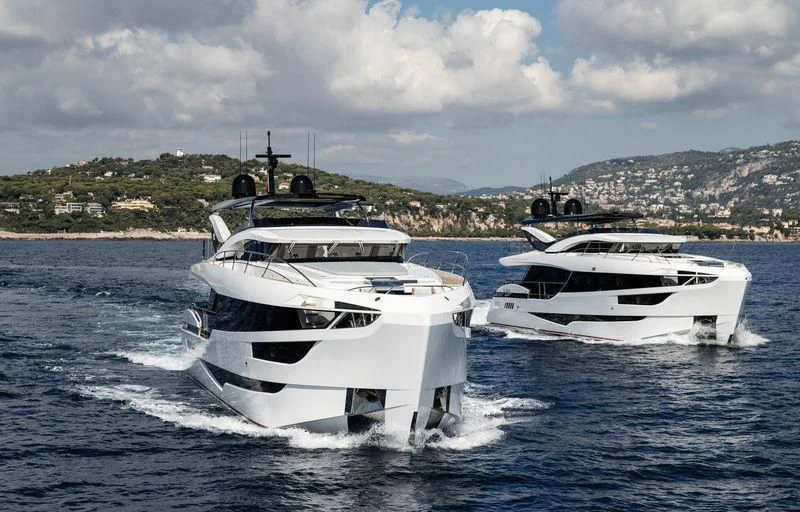 a couple of boats on the water aboard MAXIMUS Yacht for Sale