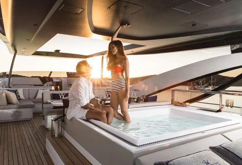 a man and a woman in a room with a pool table and chairs aboard MAXIMUS Yacht for Sale
