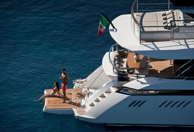 a couple of people on a boat aboard MAXIMUS Yacht for Sale