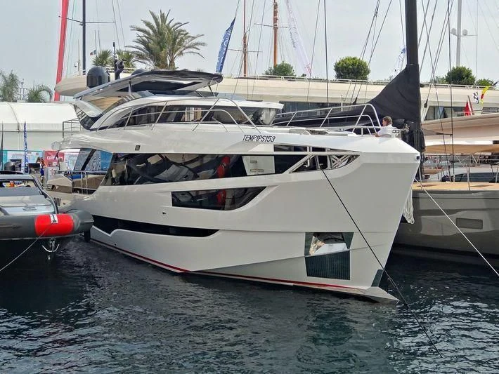 a white boat docked aboard MAXIMUS Yacht for Sale