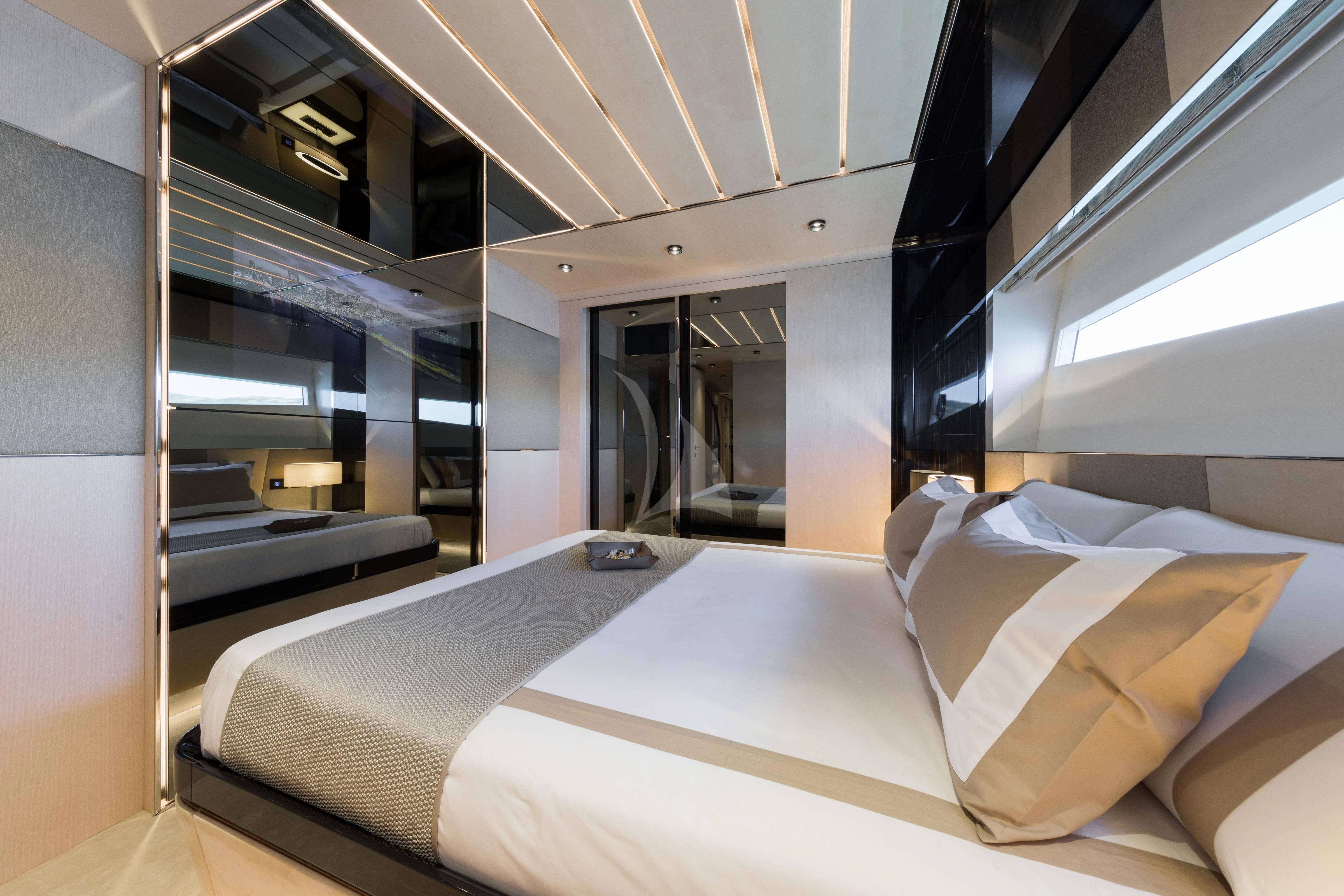a room with a bed and a desk aboard MAXIMUS Yacht for Sale