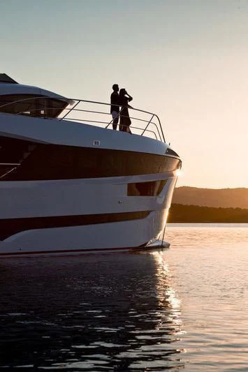 a couple of people on a boat aboard MAXIMUS Yacht for Sale