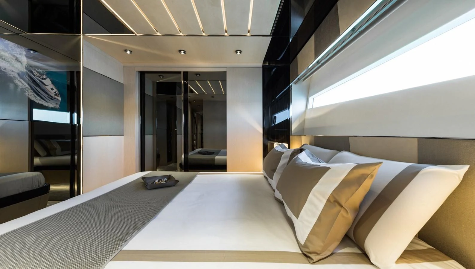 a room with a bed and a laptop on the bed aboard MAXIMUS Yacht for Sale