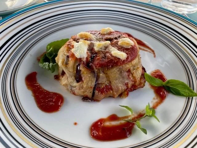 a plate of food aboard MAXIMUS Yacht for Sale