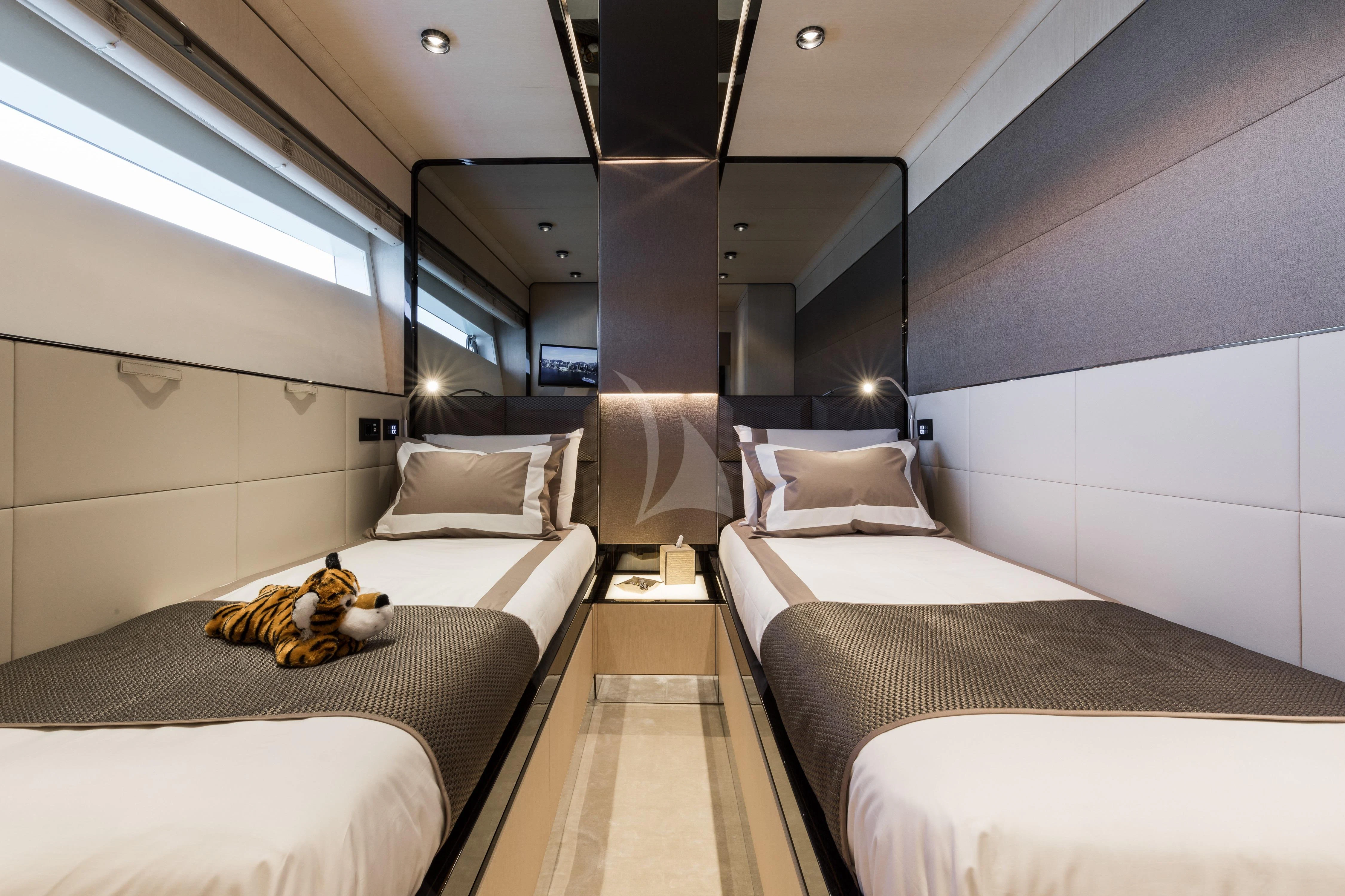 a room with beds and a stuffed toy aboard MAXIMUS Yacht for Sale