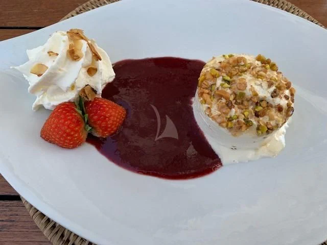 a plate of food aboard MAXIMUS Yacht for Sale