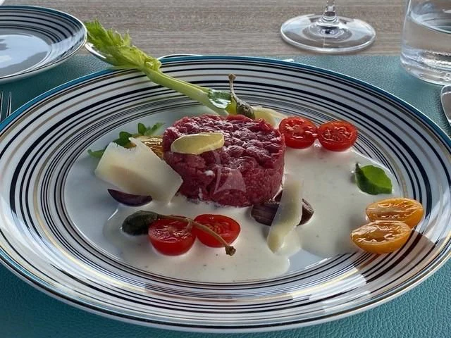 a plate of food aboard MAXIMUS Yacht for Sale