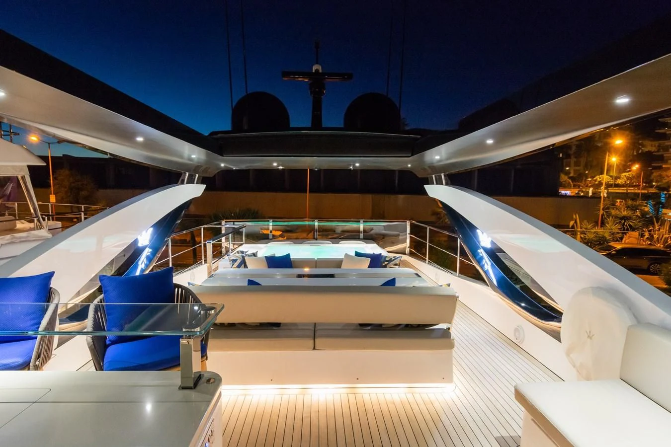 a large ship with a deck and chairs aboard MAXIMUS Yacht for Sale