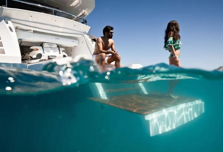 a couple of women sitting on a boat in the water aboard MAXIMUS Yacht for Sale
