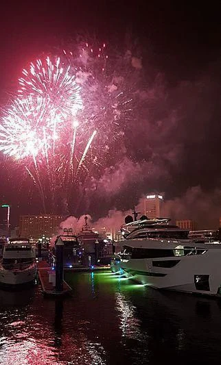 fireworks over a city aboard MAXIMUS Yacht for Sale
