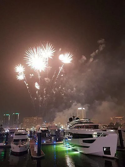 fireworks over a city aboard MAXIMUS Yacht for Sale