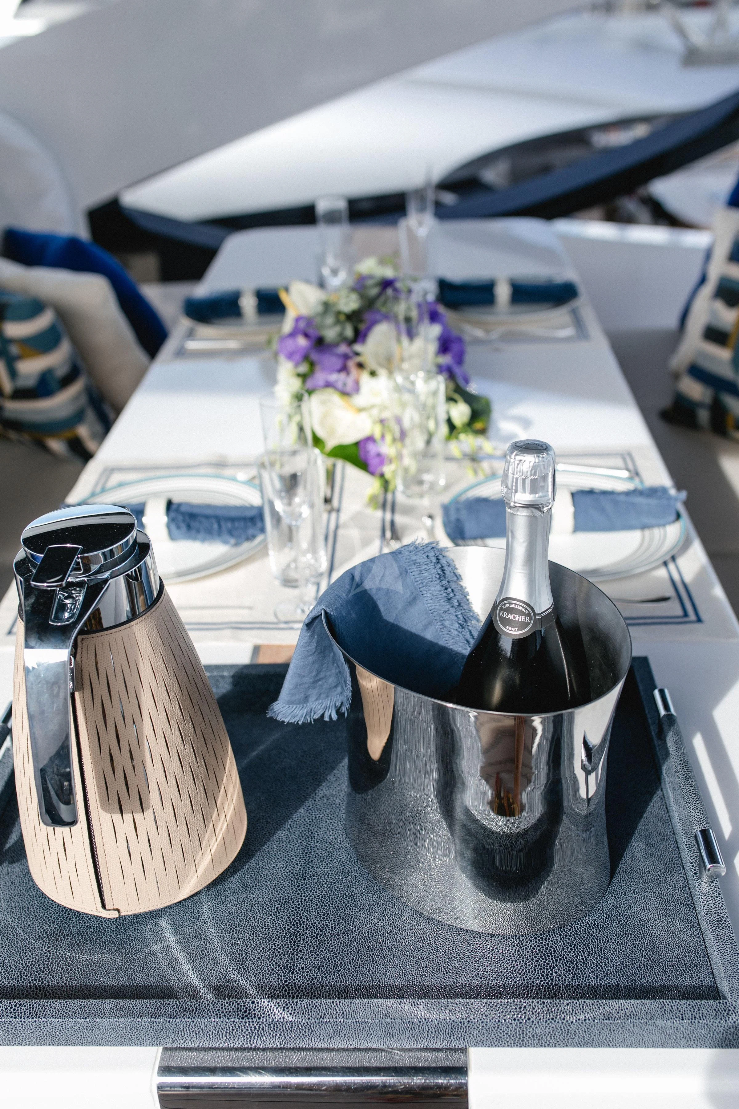 a vase with flowers on a table aboard MAXIMUS Yacht for Sale