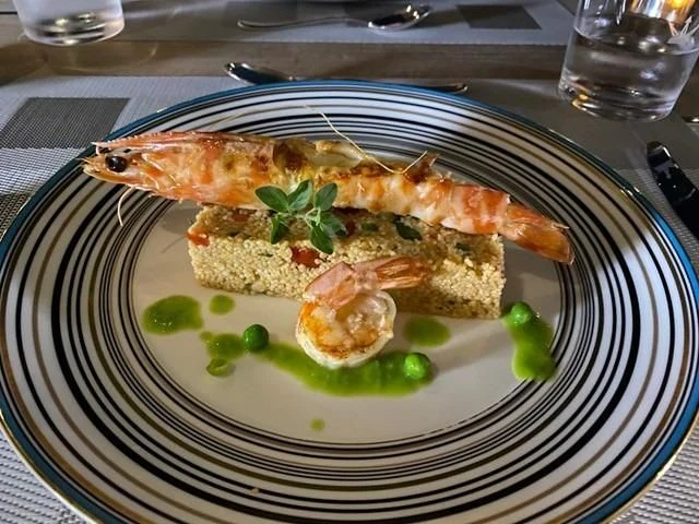 a plate of food aboard MAXIMUS Yacht for Sale