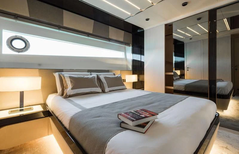a bed in a room aboard MAXIMUS Yacht for Sale