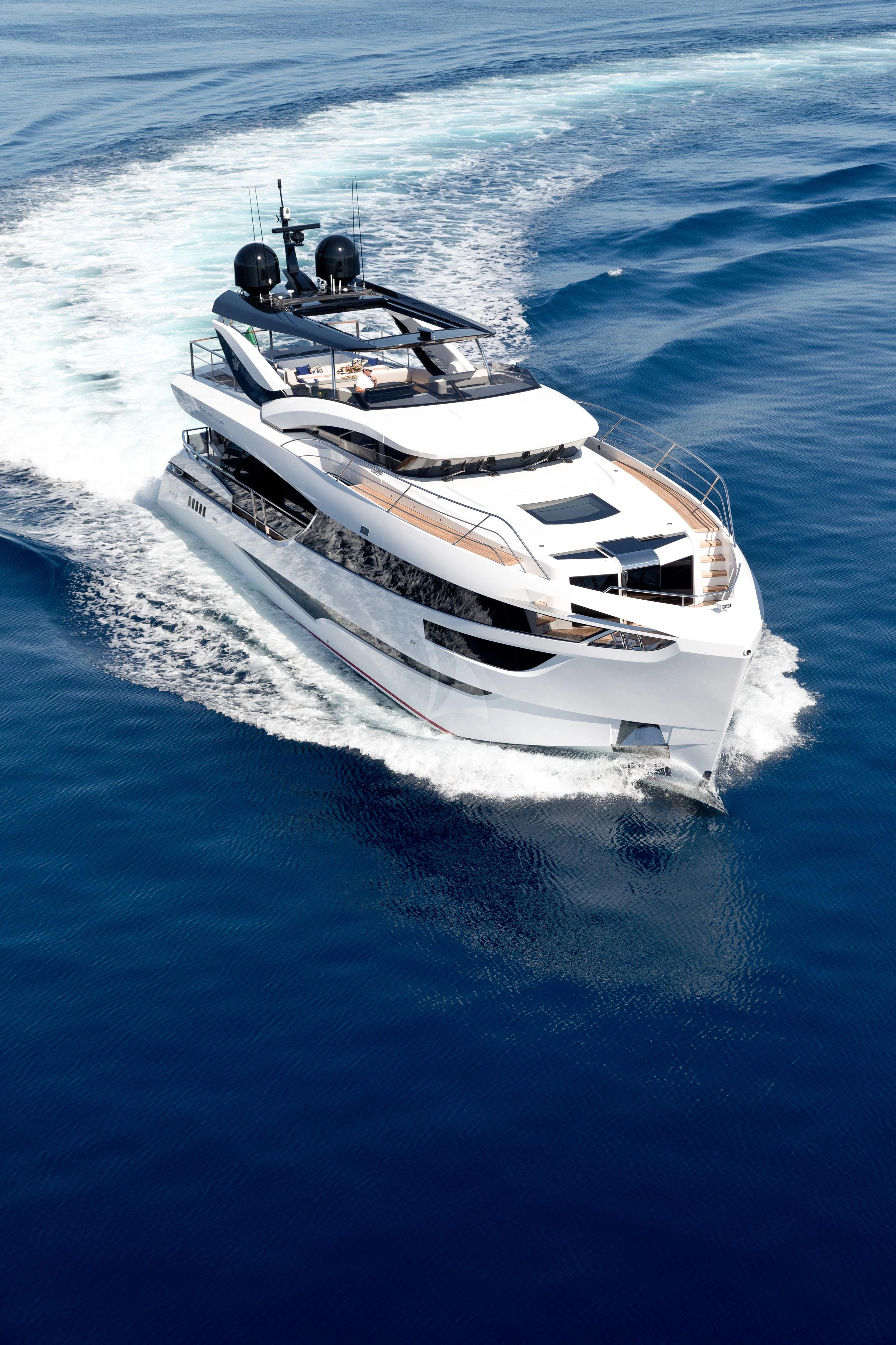a white boat on the water aboard MAXIMUS Yacht for Sale
