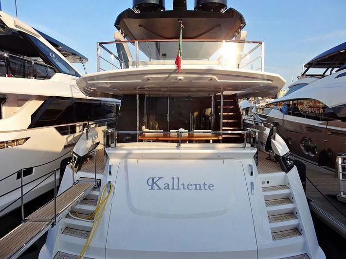 a boat with a flag on the front aboard MAXIMUS Yacht for Sale