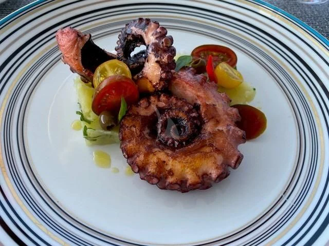 a plate of food aboard MAXIMUS Yacht for Sale