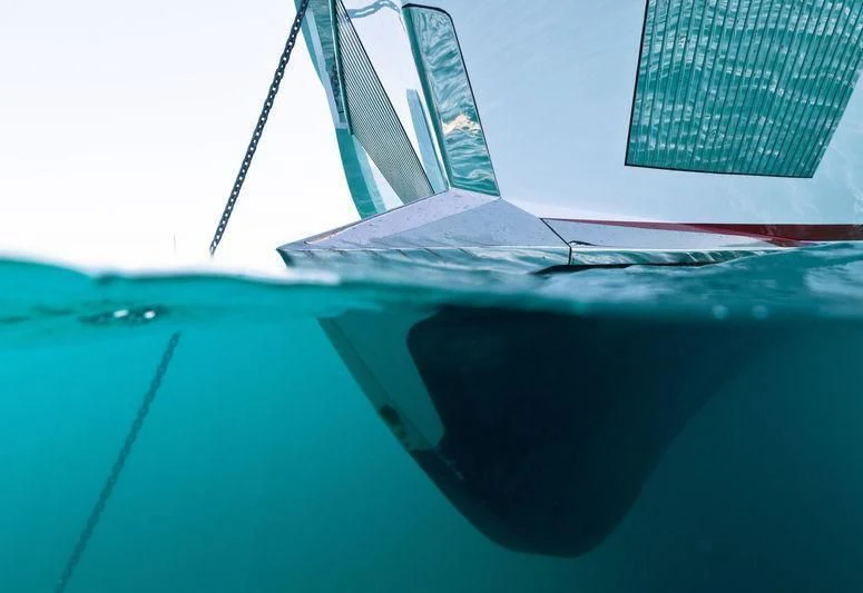 a laptop on a table aboard MAXIMUS Yacht for Sale