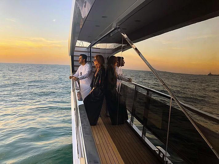 a group of people on a boat aboard MAXIMUS Yacht for Sale