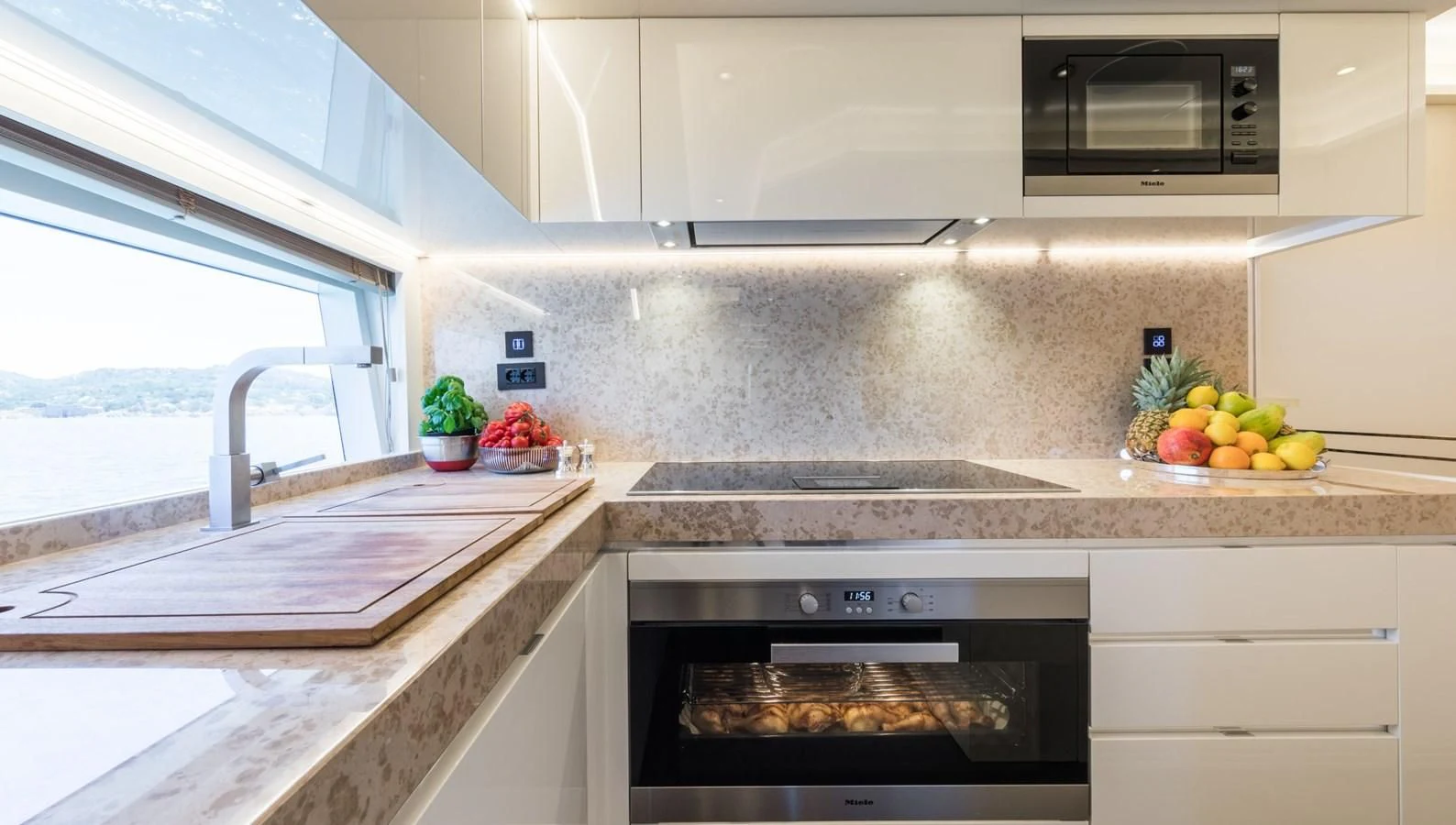 a kitchen with a stove and a window aboard MAXIMUS Yacht for Sale